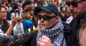 Prosecutors to appeal dismissed terror charge against Kneecap's Mo Chara image